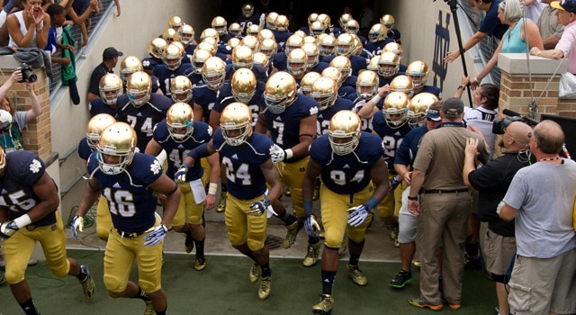 Notre Dame Fighting Irish head coach Brian Kelly leads his players onto the field before the game against the Temple Owls at Notre Dame Stadium. Notre Dame won 28-6. Mandatory Credit: Matt Cashore-USA TODAY Sports