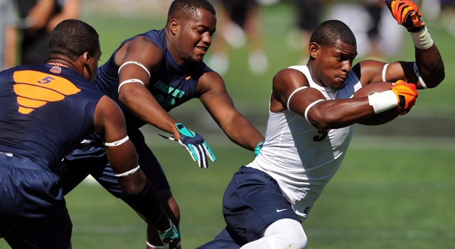 Wide receiver John "JuJu" Smith (9) tries to avoid the tackle of linebacker Jamadre Cobb (20) during the Nike 7on7 pool play at Nike World Headquarters in Beaverton, Oregon on Tuesday July, 2, 2013. (Photo: Steve Dykes-USA TODAY Sports)