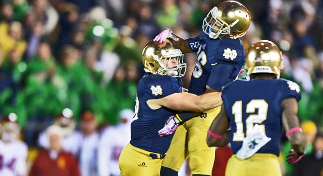 Notre Dame's Joe Schmidt and Cole Luke celebrate Schmidt's big play against the Trojans in 2013.  Can the Irish beat the USC for a 3rd year in a row in 2014?  (Photo:  Kirby Lee / USA TODAY Sports)