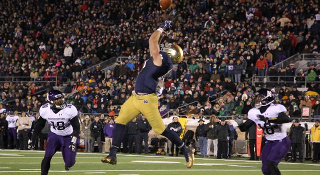 Nov 15, 2014; South Bend, IN, USA; Notre Dame Fighting Irish tight end Ben Koyack (18) goes up for a pass that was thrown just out of his reach during a game against the Northwestern Wildcats at Notre Dame Stadium. Northwestern defeated Notre Dame in overtime 43-40. Mandatory Credit: Brian Spurlock-USA TODAY Sports