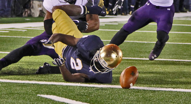 Notre Dame Fighting Irish wide receiver Chris Brown (2) fumbles the ball on the 1 yard line after being tackled by Northwestern Wildcats safety Ibraheim Campbell (24) at Notre Dame Stadium. Mandatory Credit: Brian Spurlock-USA TODAY Sports