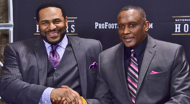 Pittsburgh Steelers former running back Jerome Bettis (left) and Oakland Raiders and Los Angeles Raiders former receiver Tim Brown react during a press conference to introduce the 2015 Pro Football Hall of Fame inductees at Symphony Hall. (Photo:  Kirby Lee // USA TODAY Sports)