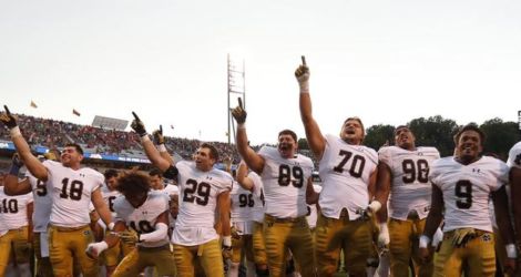 Sep 12, 2015; Charlottesville, VA, USA; Notre Dame Fighting Irish sing the school alma mater after their game against the Virginia Cavaliers at Scott Stadium. The Fighting Irish won 34-27. Mandatory Credit: Geoff Burke-USA TODAY Sports