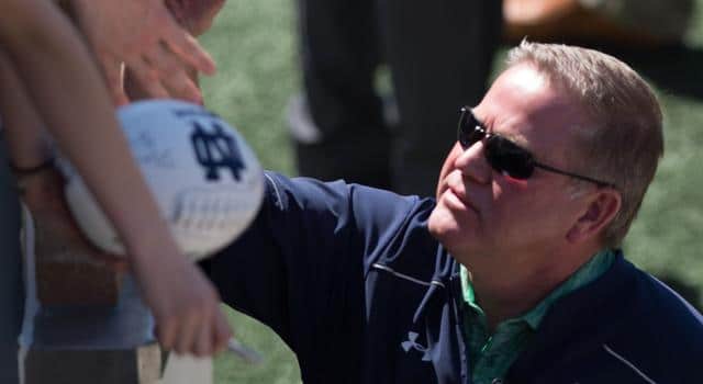 : Apr 16, 2016; South Bend, IN, USA; Notre Dame Fighting Irish head coach Brian Kelly greets fans before the Blue-Gold Game at Notre Dame Stadium. The Blue team defeated the Gold team 17-7. Mandatory Credit: Matt Cashore-USA TODAY Sports