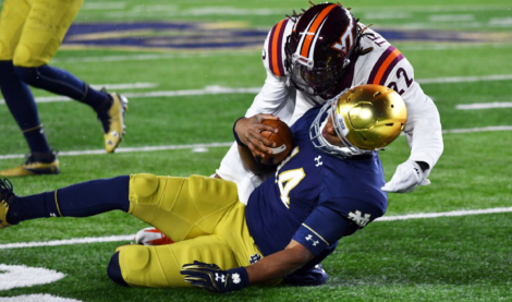 Notre Dame QB Deshone Kizer taking one of two uncalled helmet to helmet hits in 2016 contest with Virginia Tech