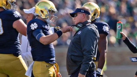 Notre Dame QB Ian Book and head coach Brian Kelly
