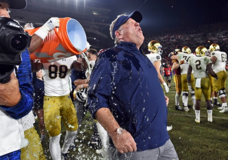 Notre Dame Heach Coach Brian Kelly gets showered in Gatorade after another perfect regular season.