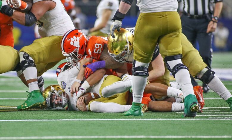 Notre Dame QB Ian Book sacked one of six times by Clemson.