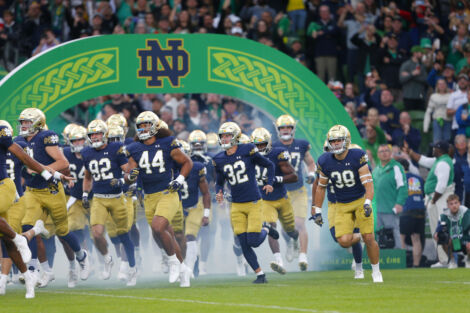 Notre Dame football team running out of the tunnel