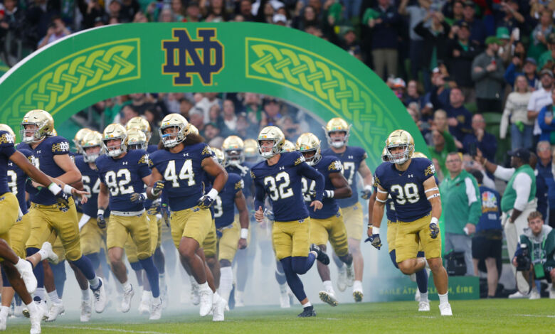 Notre Dame football team running out of the tunnel