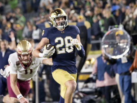Notre Dame Fighting Irish safety Luke Talich (28) runs the ball for a touchdown