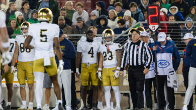 Jeremiyah Love #4 and Nolan James Jr. #23 of the Notre Dame Fighting Irish