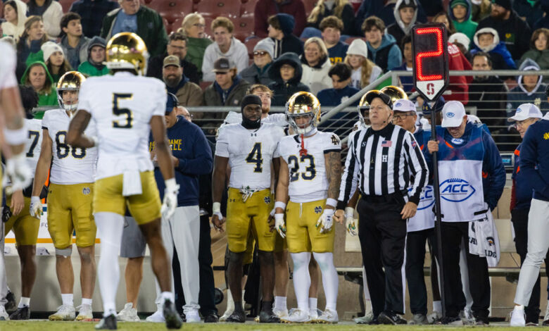 Jeremiyah Love #4 and Nolan James Jr. #23 of the Notre Dame Fighting Irish
